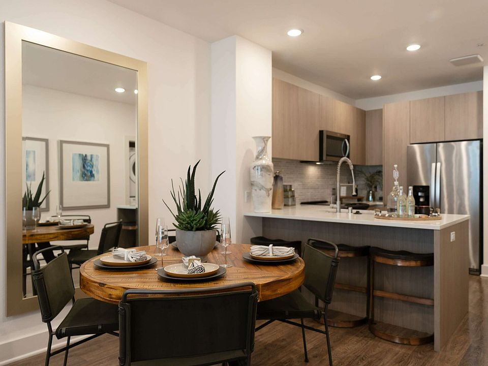 Gather, dine, and entertain effortlessly in this warm, modern space with sleek finishes and an inviting layout.